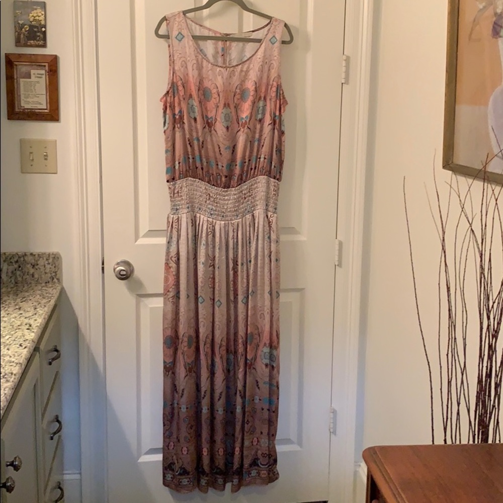 Blouson styled dress with a smocked waistline.